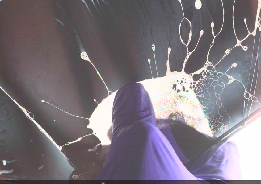 Liquid crystal spreading in violet under the pressure of a hand.