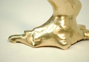 Detail of the bronze base, where the drop meets the ground.